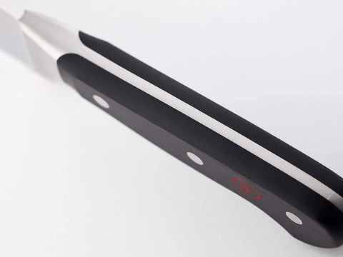 Wüsthof Classic 6-inch carving fork detail showing tines and secure grip for stable carving