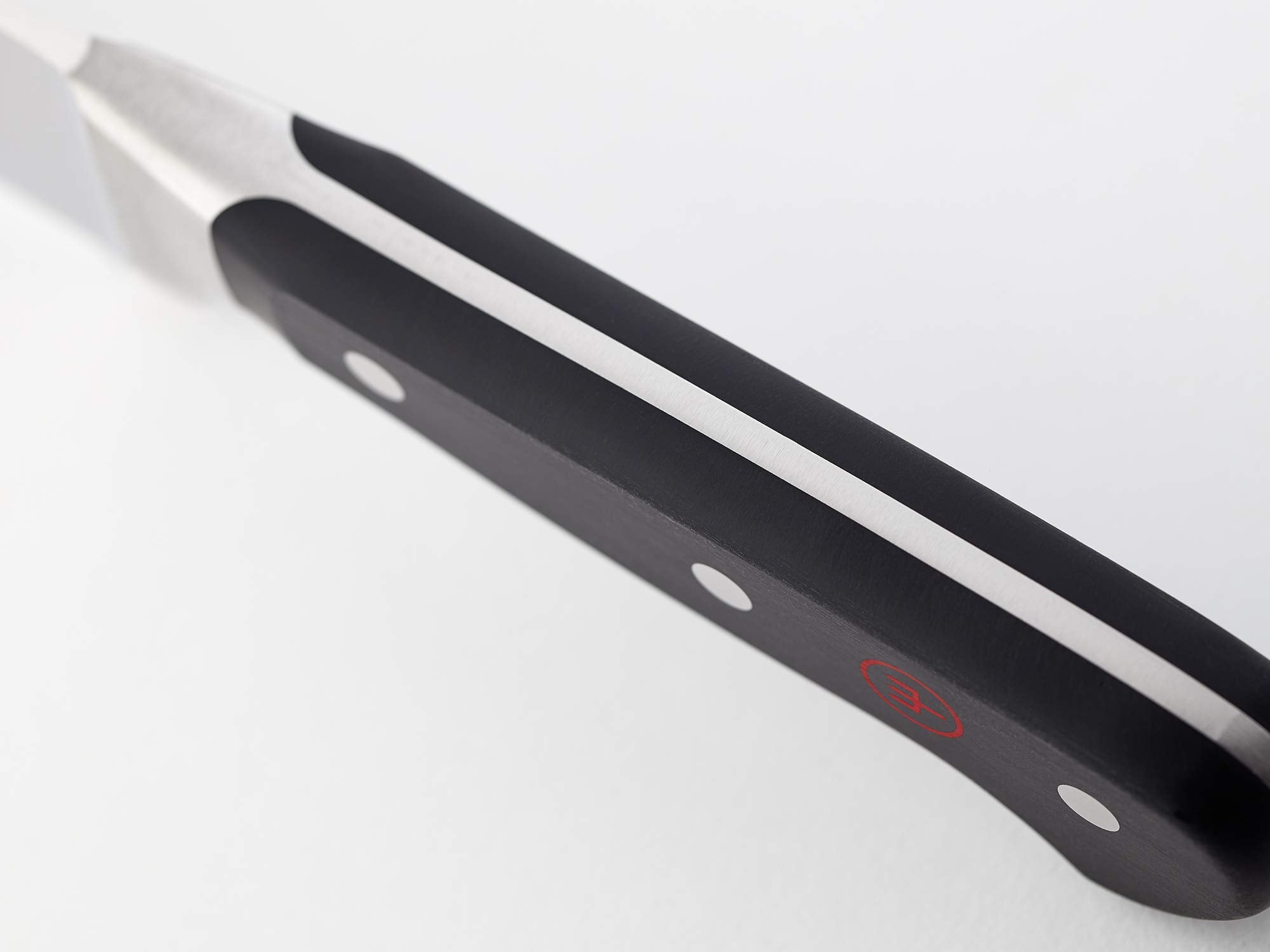 Wüsthof Classic handle close-up with triple-riveted full-tang for comfortable balance