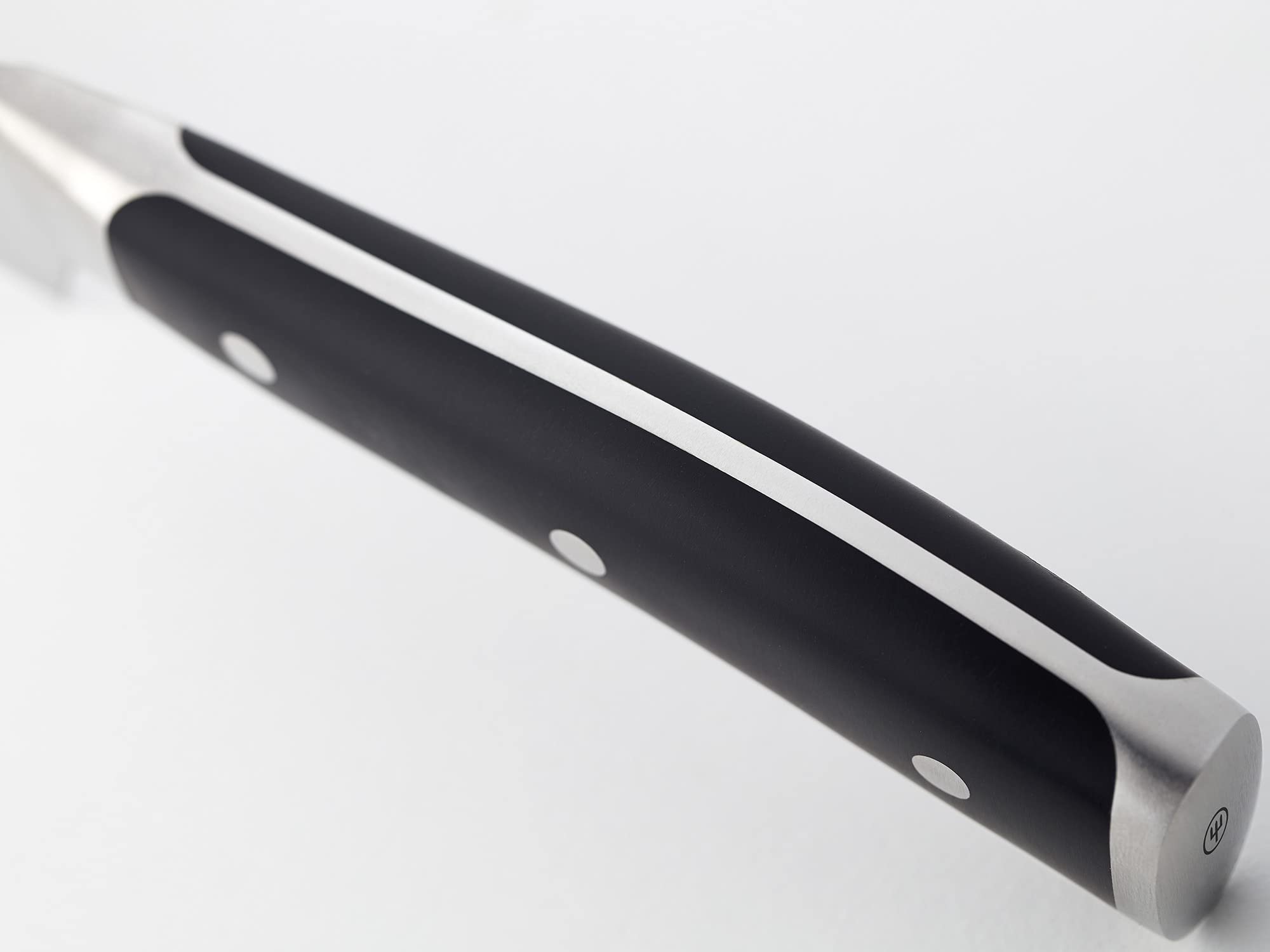 Wüsthof Classic Ikon handle detail highlighting ergonomic grip benefit