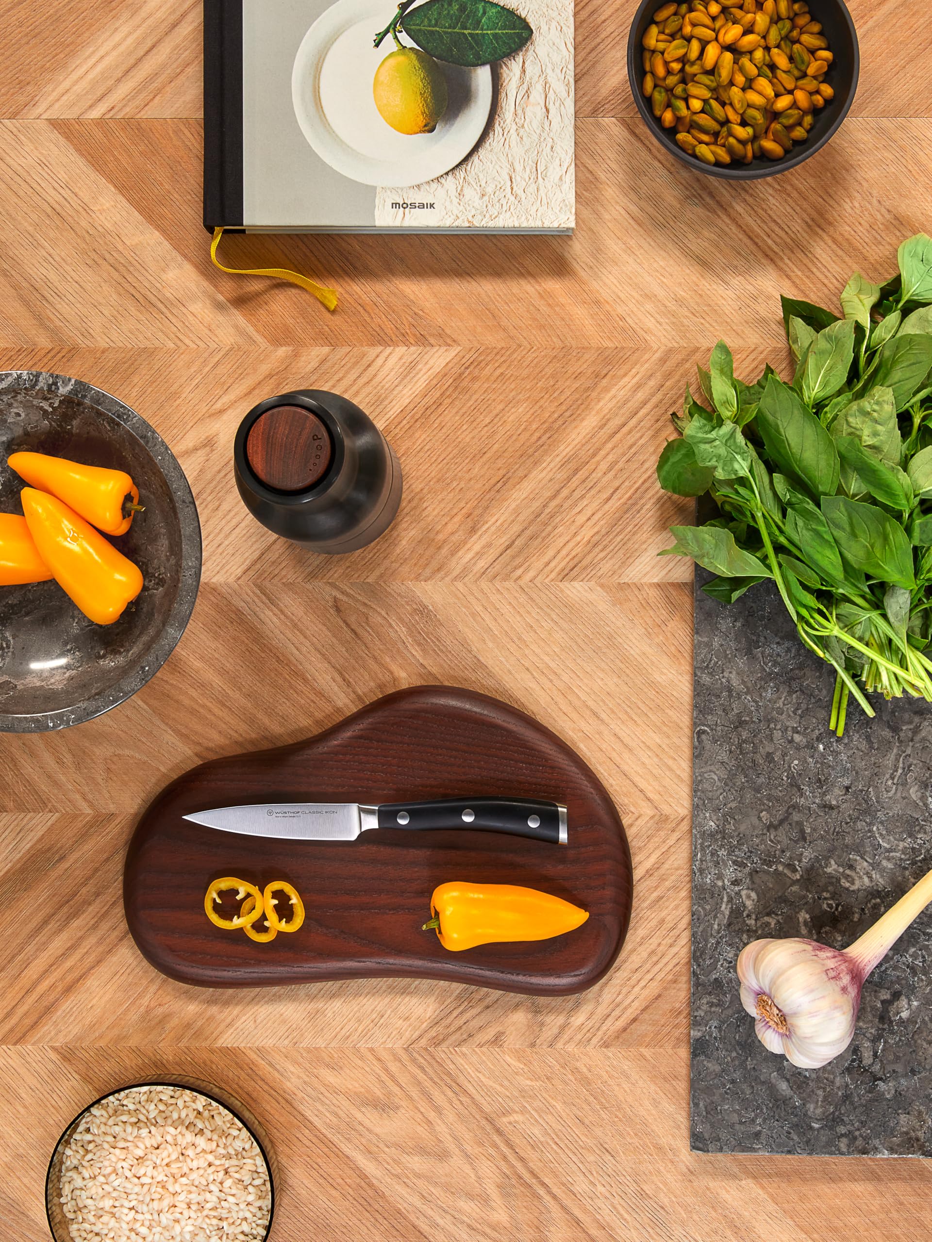 Wüsthof paring knife held in hand to show scale and comfortable handling
