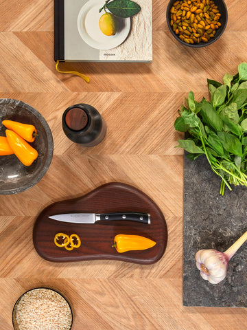 Wüsthof paring knife held in hand to show scale and comfortable handling