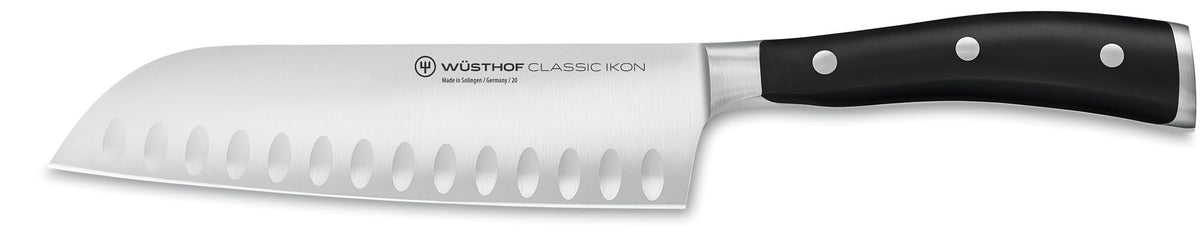 Wüsthof Classic IKON santoku front view showing balanced shape and black handle for precise cutting