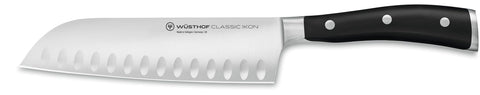 Wüsthof Classic IKON santoku front view showing balanced shape and black handle for precise cutting