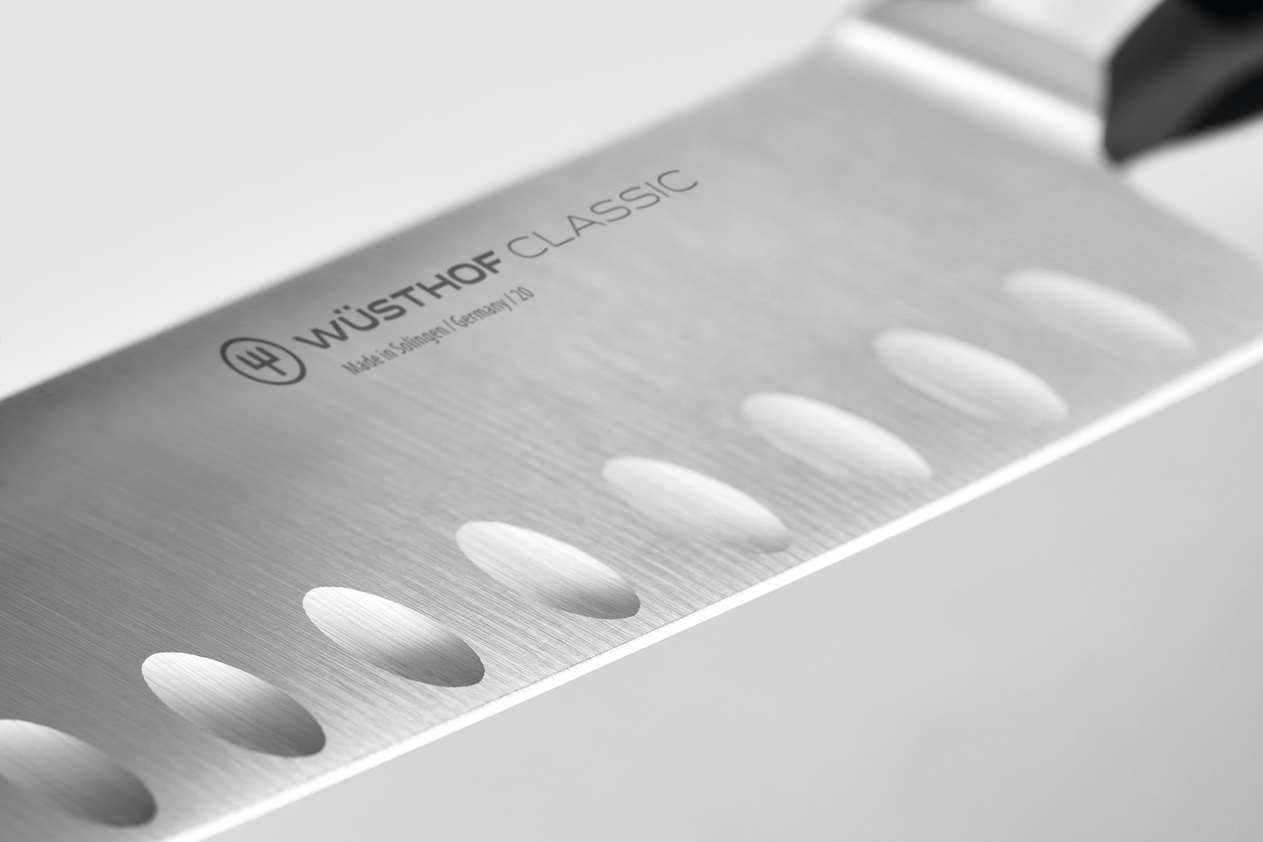 Wüsthof Classic Santoku blade close-up highlighting fine edge for precise cuts