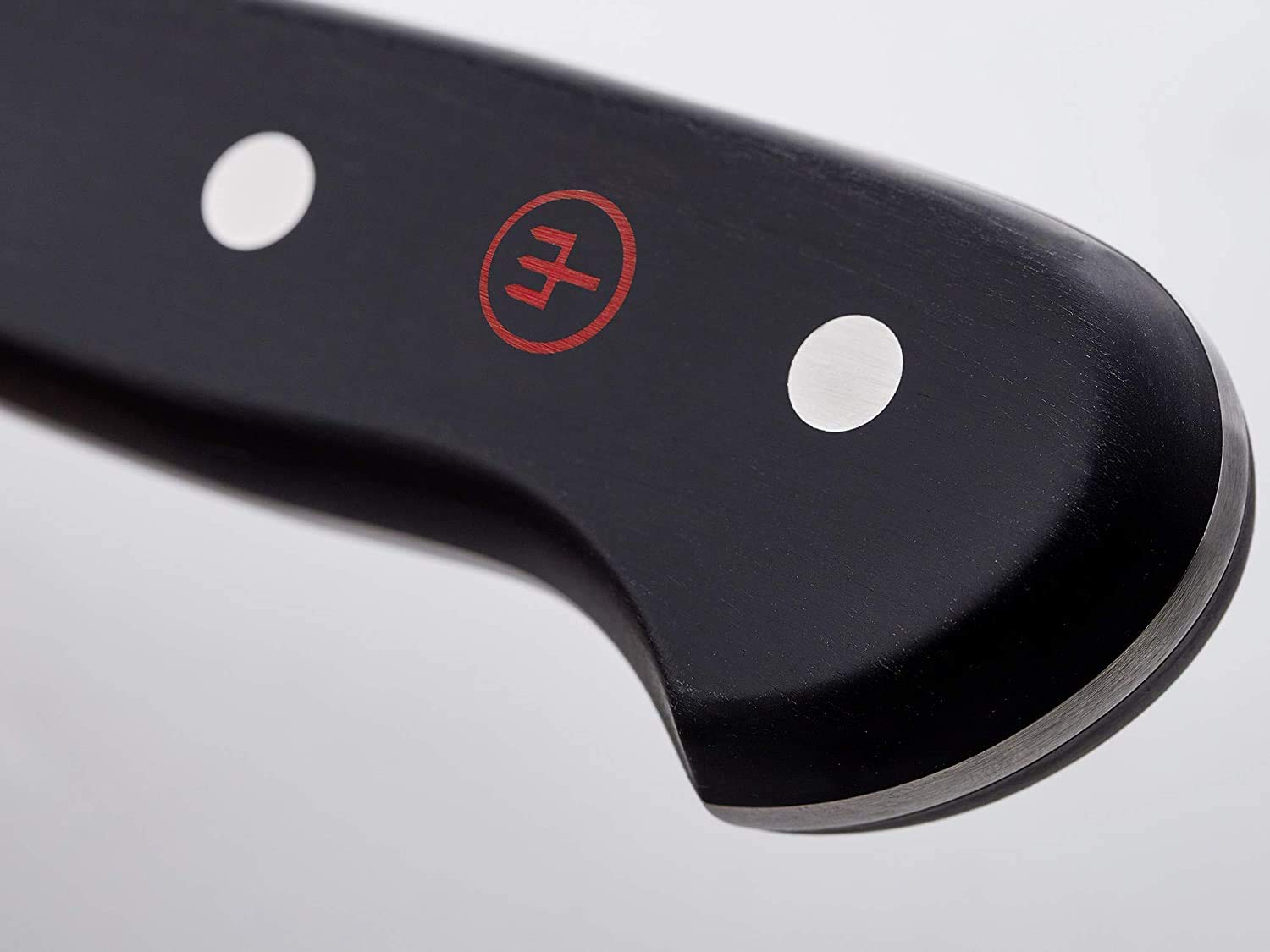 Wüsthof Classic set in use carving a golden turkey, delivering smooth even slices with less sticking