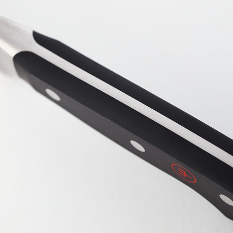 Wüsthof cleaver handle close-up showing square handle for secure ergonomic grip