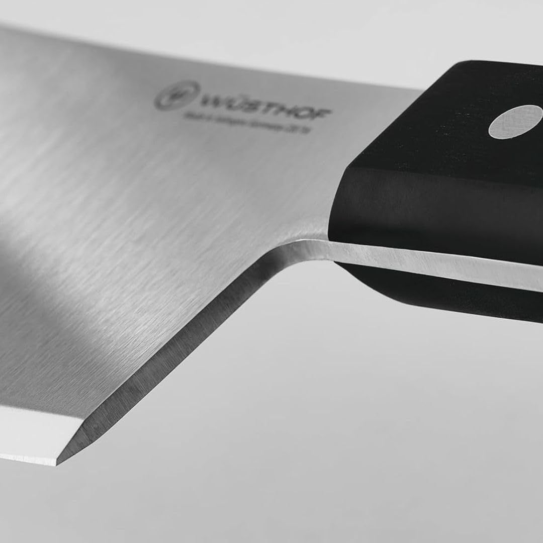 Wüsthof cleaver slicing through ribs demonstrating powerful, fatigue-reducing performance