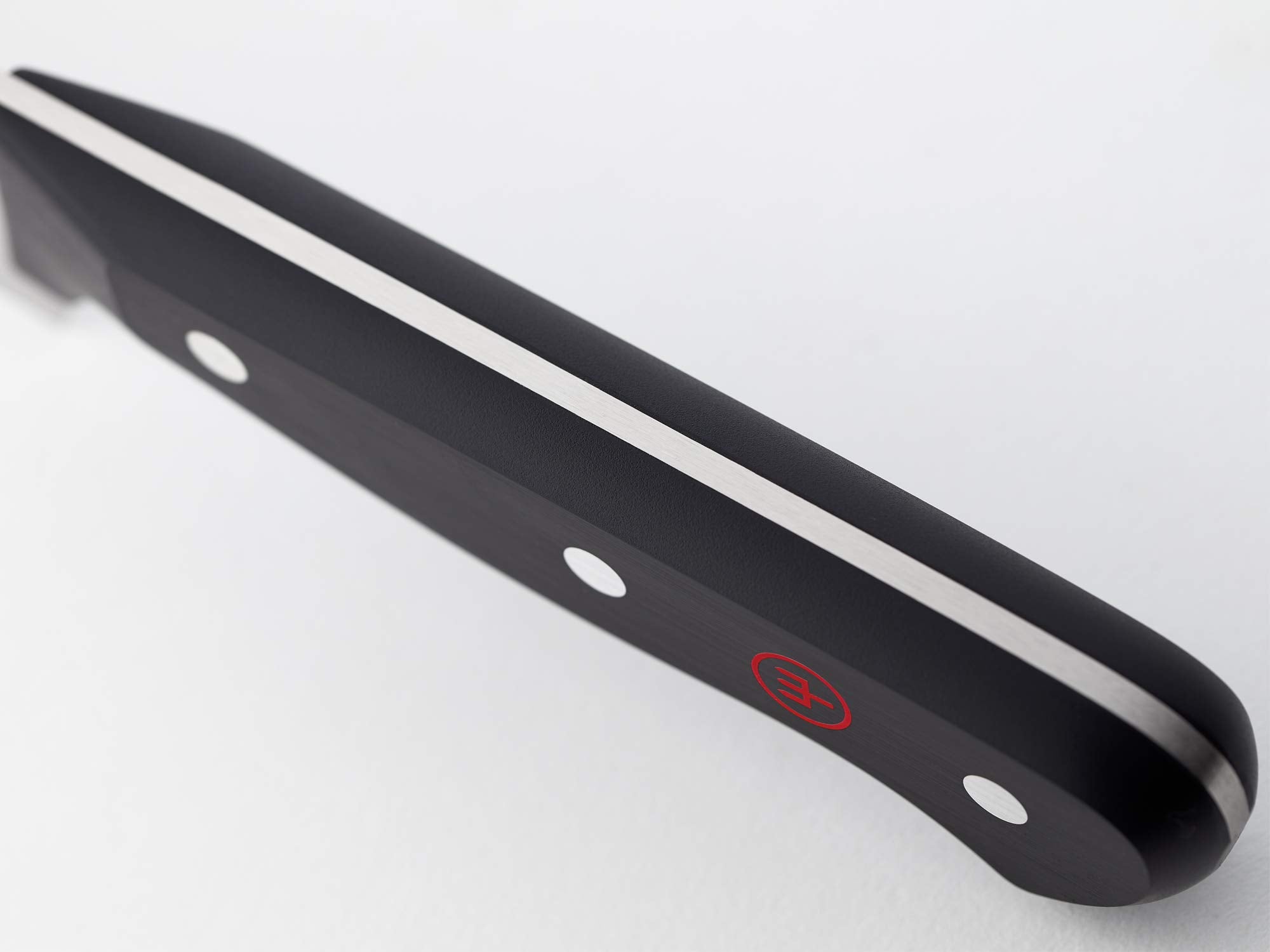 Wüsthof handle detail showing riveted polypropylene grip for long-lasting comfort