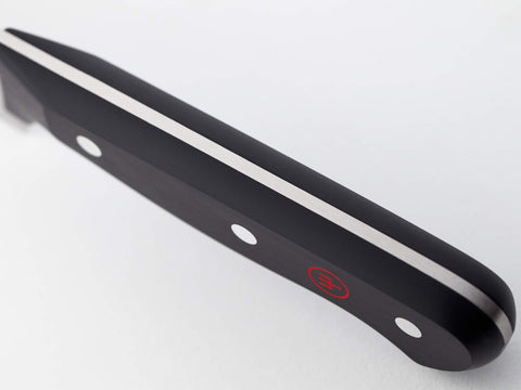 Wüsthof handle detail showing riveted polypropylene grip for long-lasting comfort