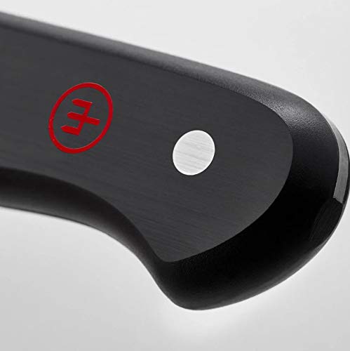Wüsthof knives next to hand for scale showing compact set convenience and control