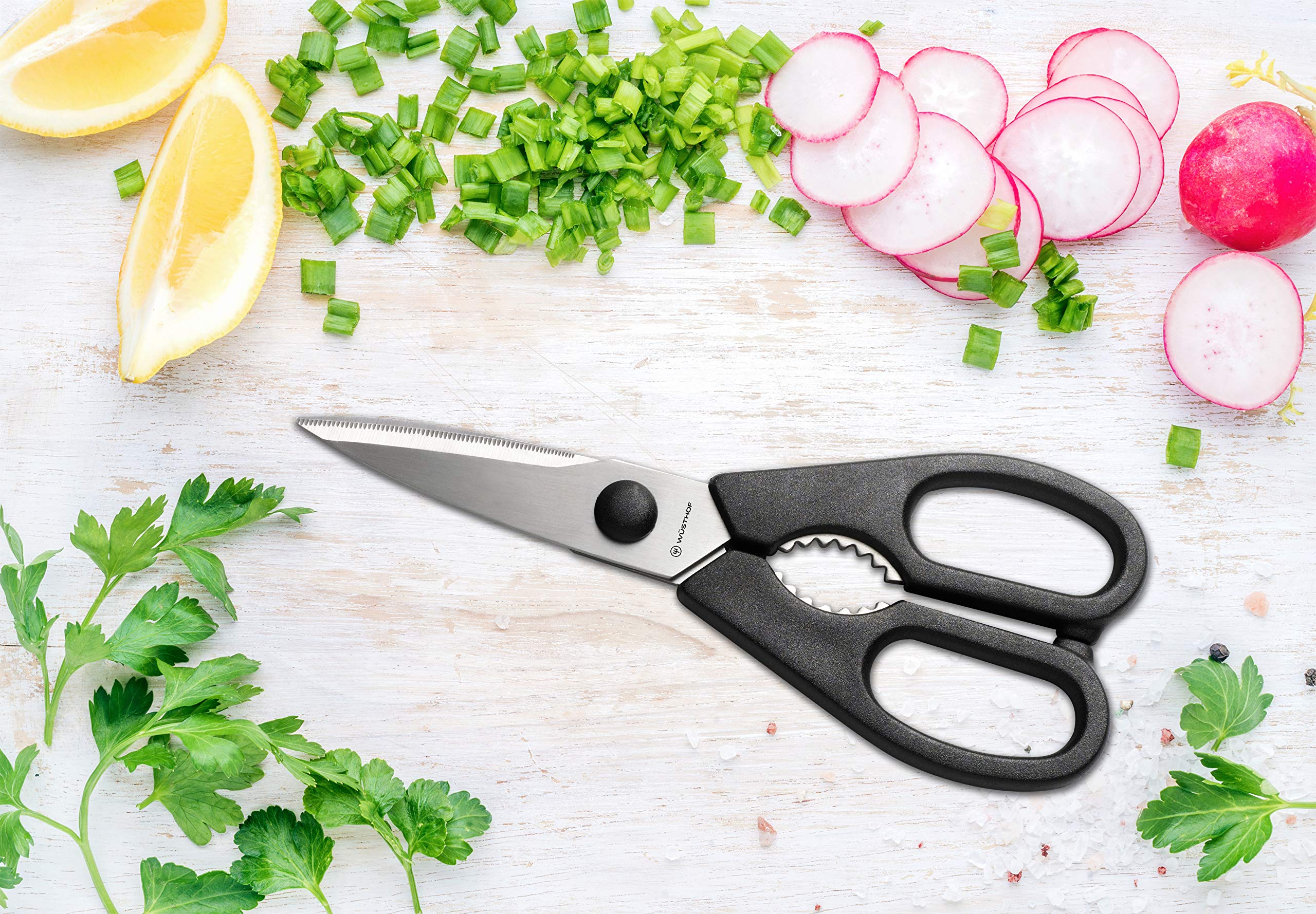 Wüsthof kitchen shears and honing steel displayed together for maintenance and utility