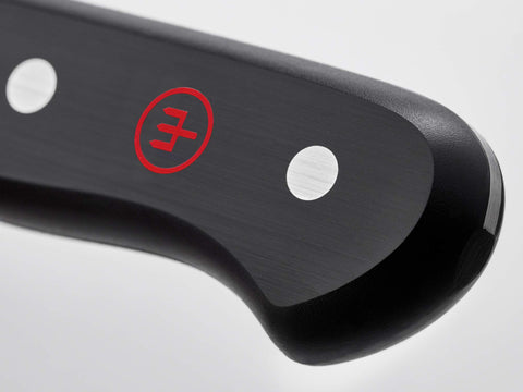 Wüsthof santoku in use chopping vegetables for faster, controlled prep
