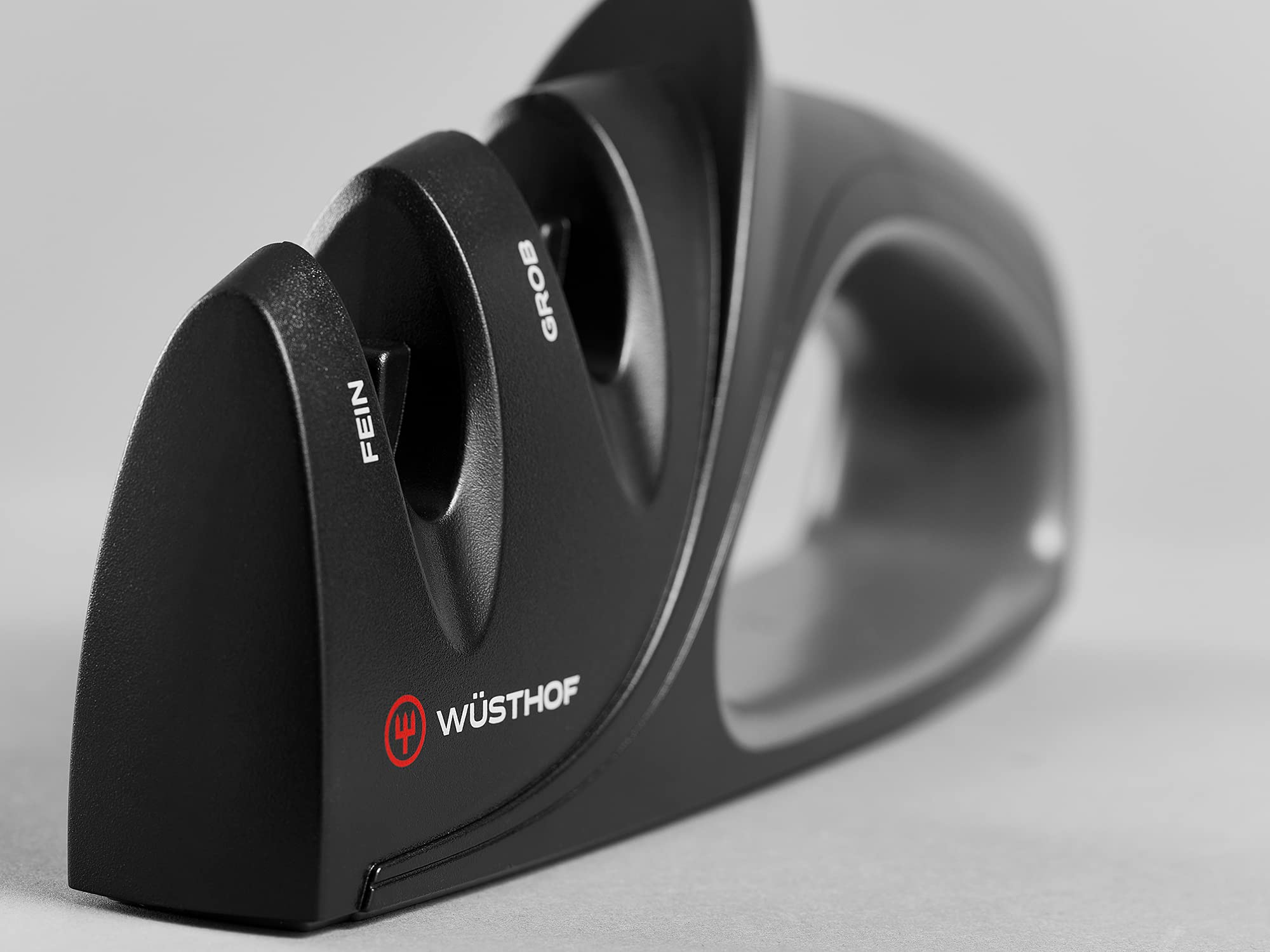 Wüsthof sharpener in use in kitchen demonstrating easy blade sharpening benefit