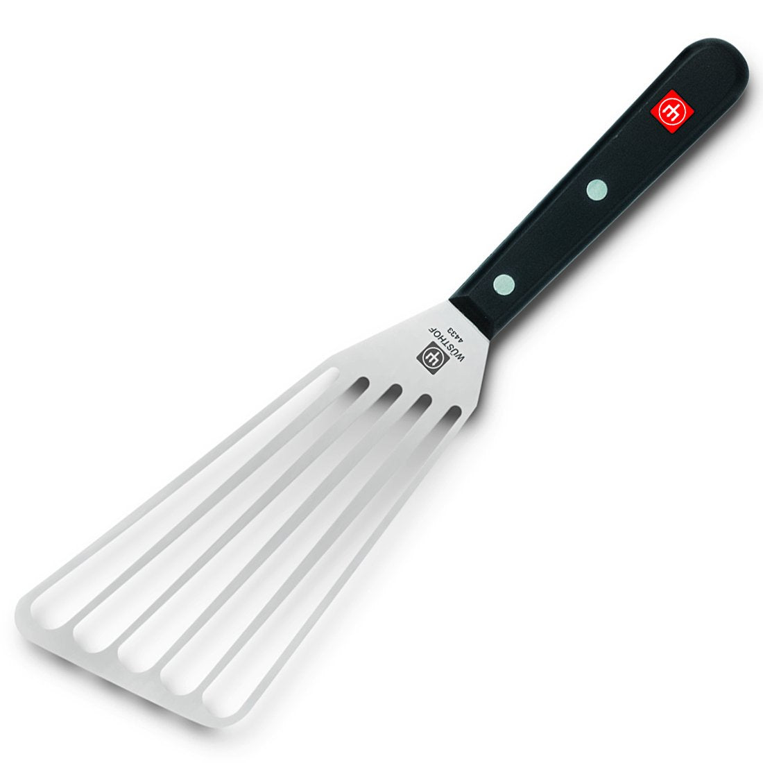 Wüsthof spatula in kitchen use flipping a pancake to demonstrate precise turning and draining