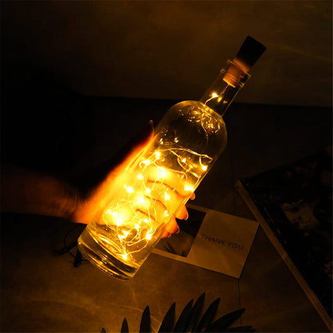 WUWEOT bottle next to hand for size comparison showing 750ml capacity