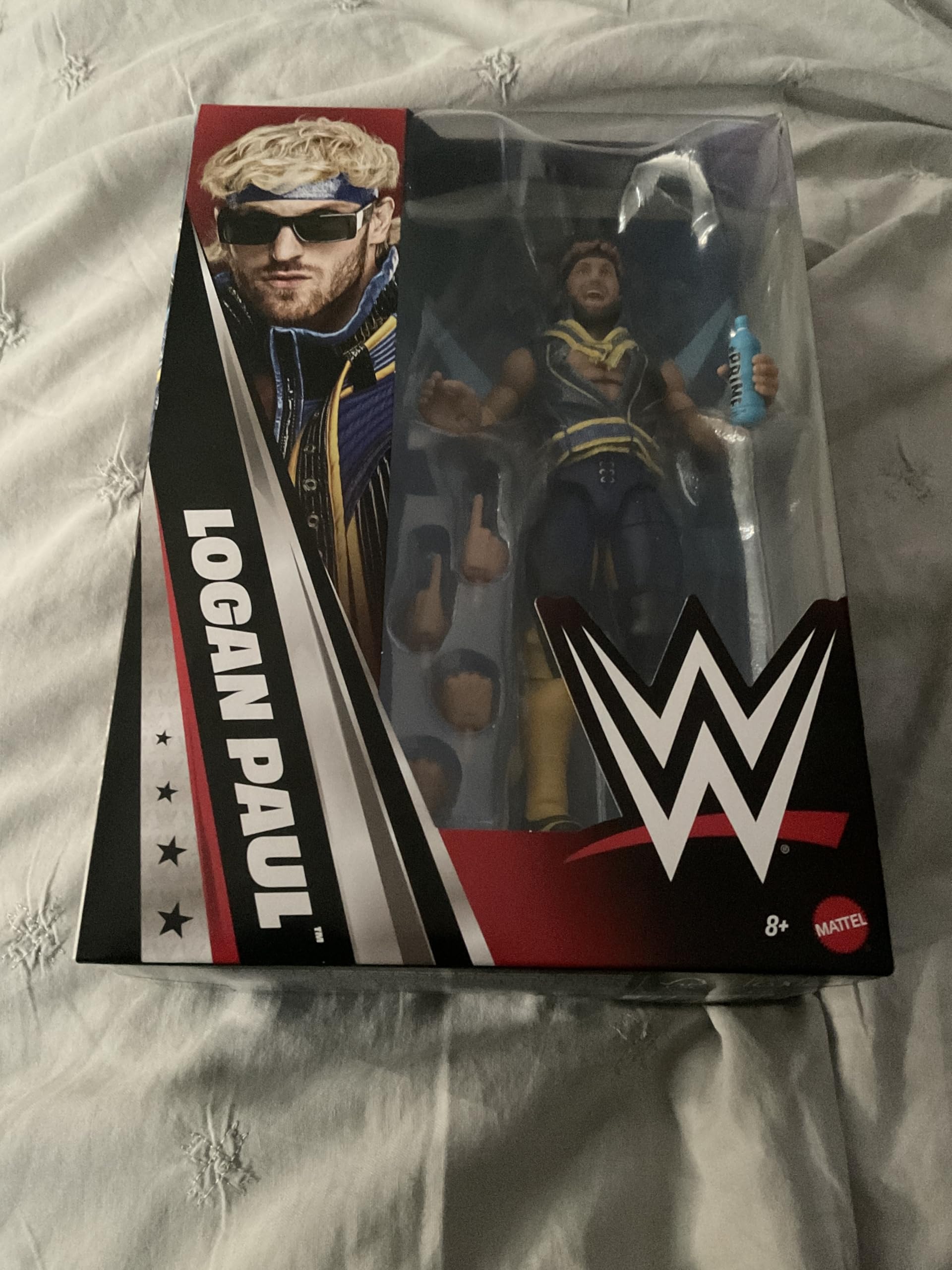 WWE Logan Paul size comparison next to wrestling ring for scale