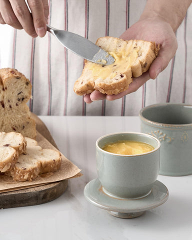 XELA butter crock next to a butter knife for scale showing countertop footprint