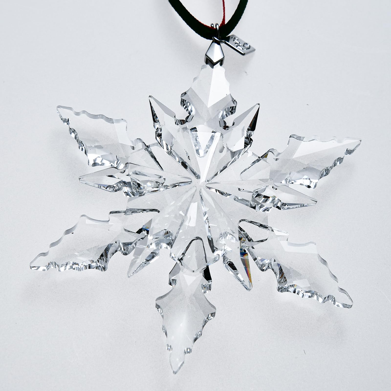 XIANGBAN ornament hanging on a Christmas tree adding elegant sparkle benefit