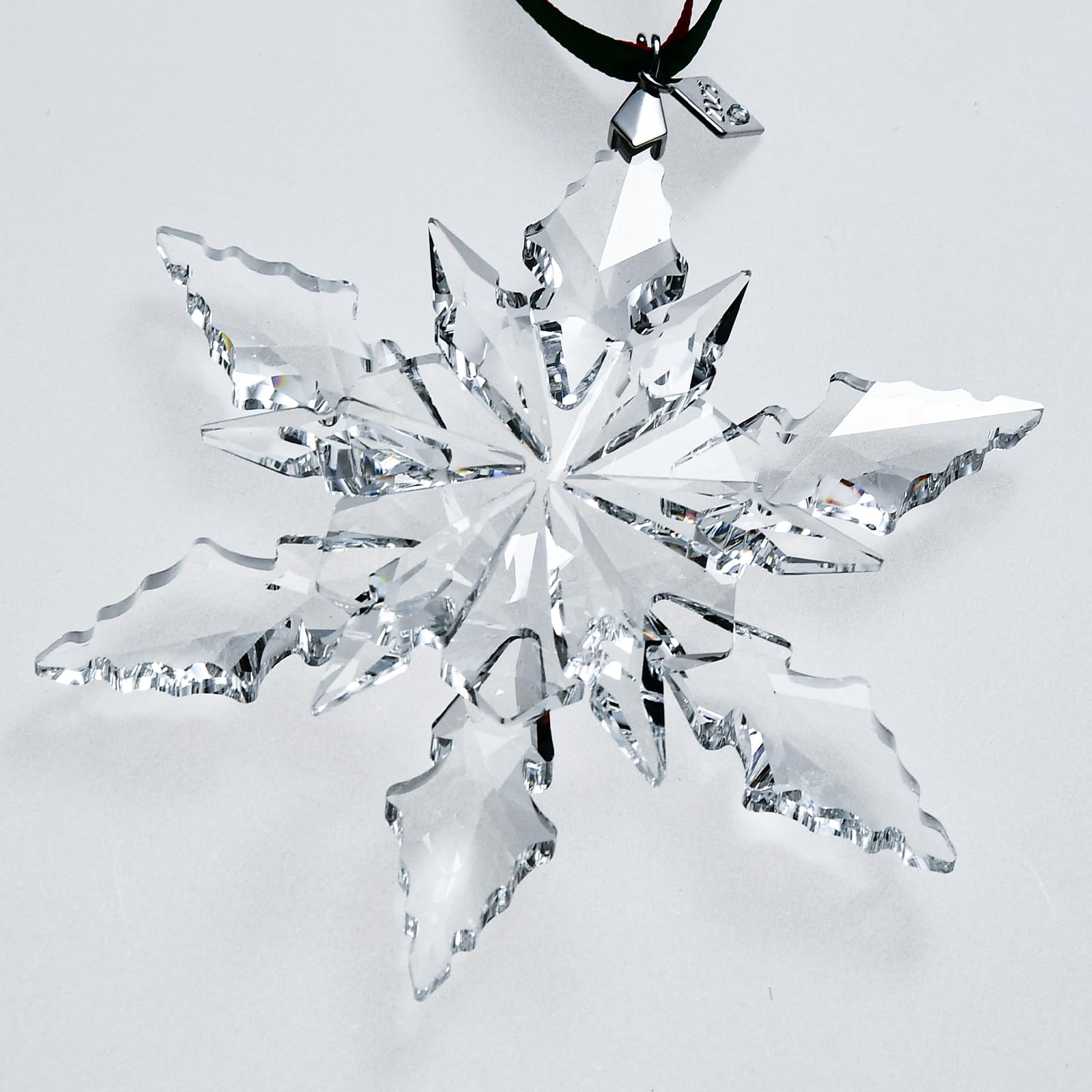 XIANGBAN snowflake in window with sunlit refraction creating rainbow accents benefit