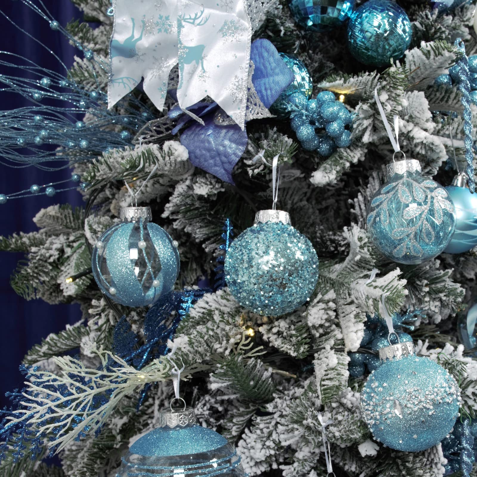 XmasExp ornaments hung on a decorated Christmas tree adding safe shatterproof sparkle