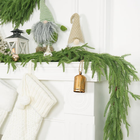 XmasExp garland styled on a mantle with lights showing festive enhancement