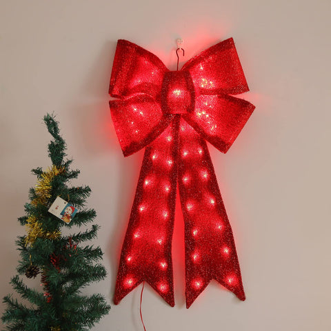 Xmasnova bow glowing at night demonstrating vivid holiday ambiance