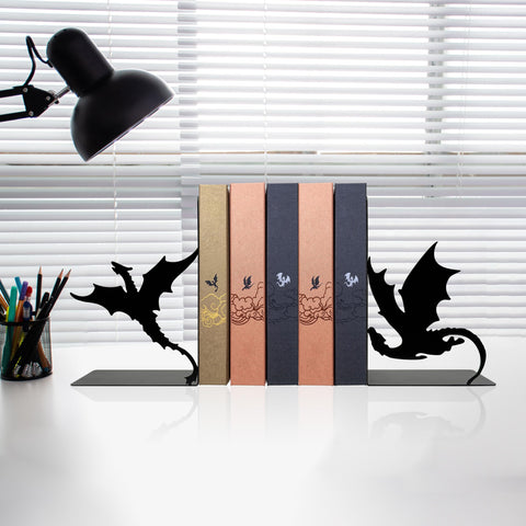 Xyverart bookend beside a novel showing compact size and scale advantage