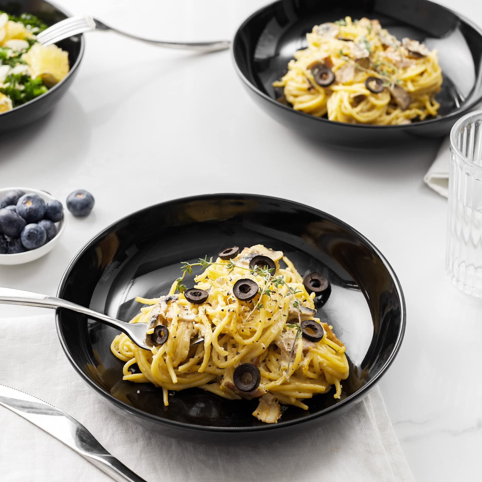 Y YHY bowl filled with pasta showing wide rim for easy serving benefit
