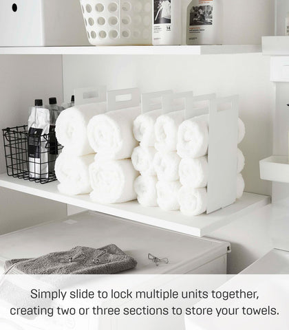 YAMAZAKI tower holding rolled towels to show upright stacking and order
