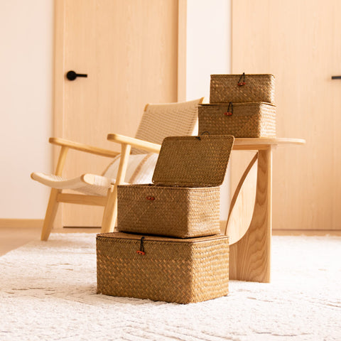 YANGQIHOME basket holding towels showing bathroom storage convenience