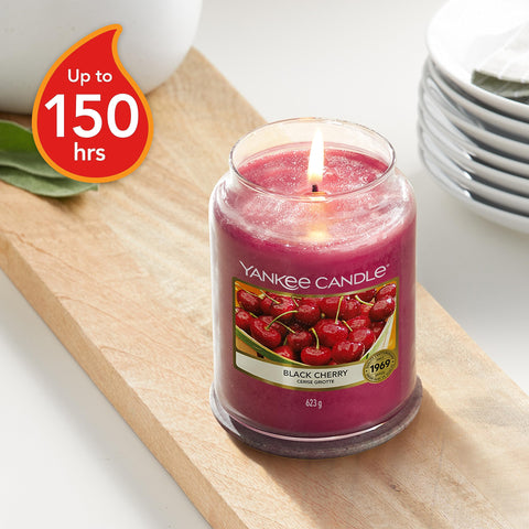 Yankee Candle black cherry single wick detail shows hand-straightened wick for even burn
