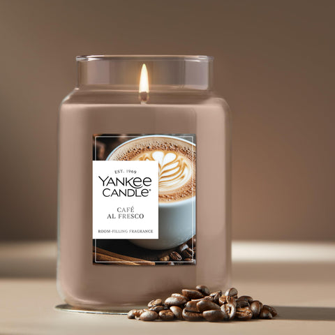 Yankee Candle Café Al Fresco lit in living room creating cozy atmosphere
