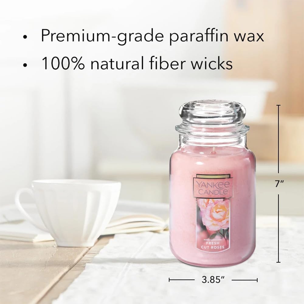 Yankee Candle next to a book to show 22oz size and scale benefit