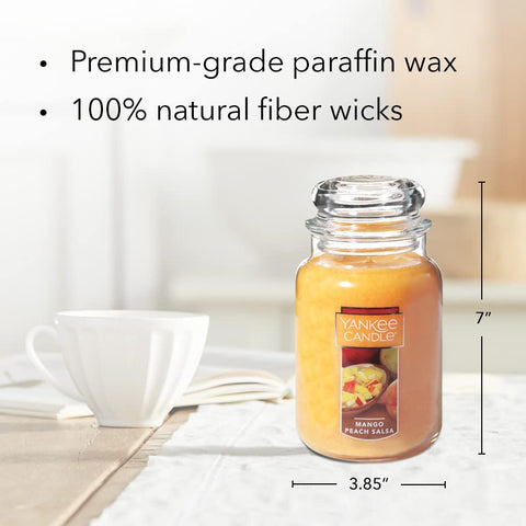 Yankee Candle lit jar in a living room demonstrating warm ambiance and scent diffusion