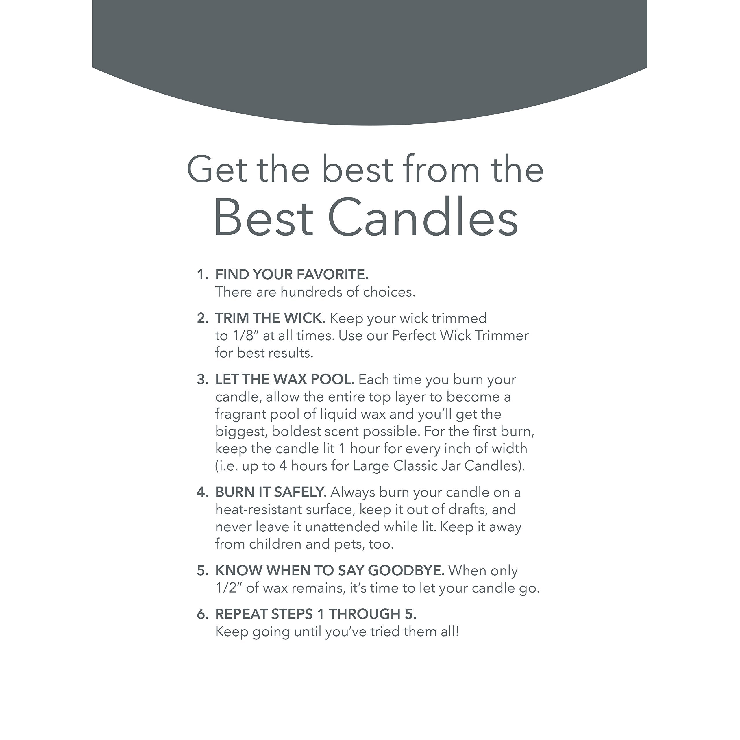 Yankee Candle Midnight Jasmine lit candle in living room creating warm fragrant ambiance