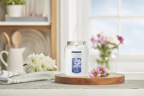Yankee Candle Midnight Jasmine beside ruler showing 22oz size and recyclable glass jar