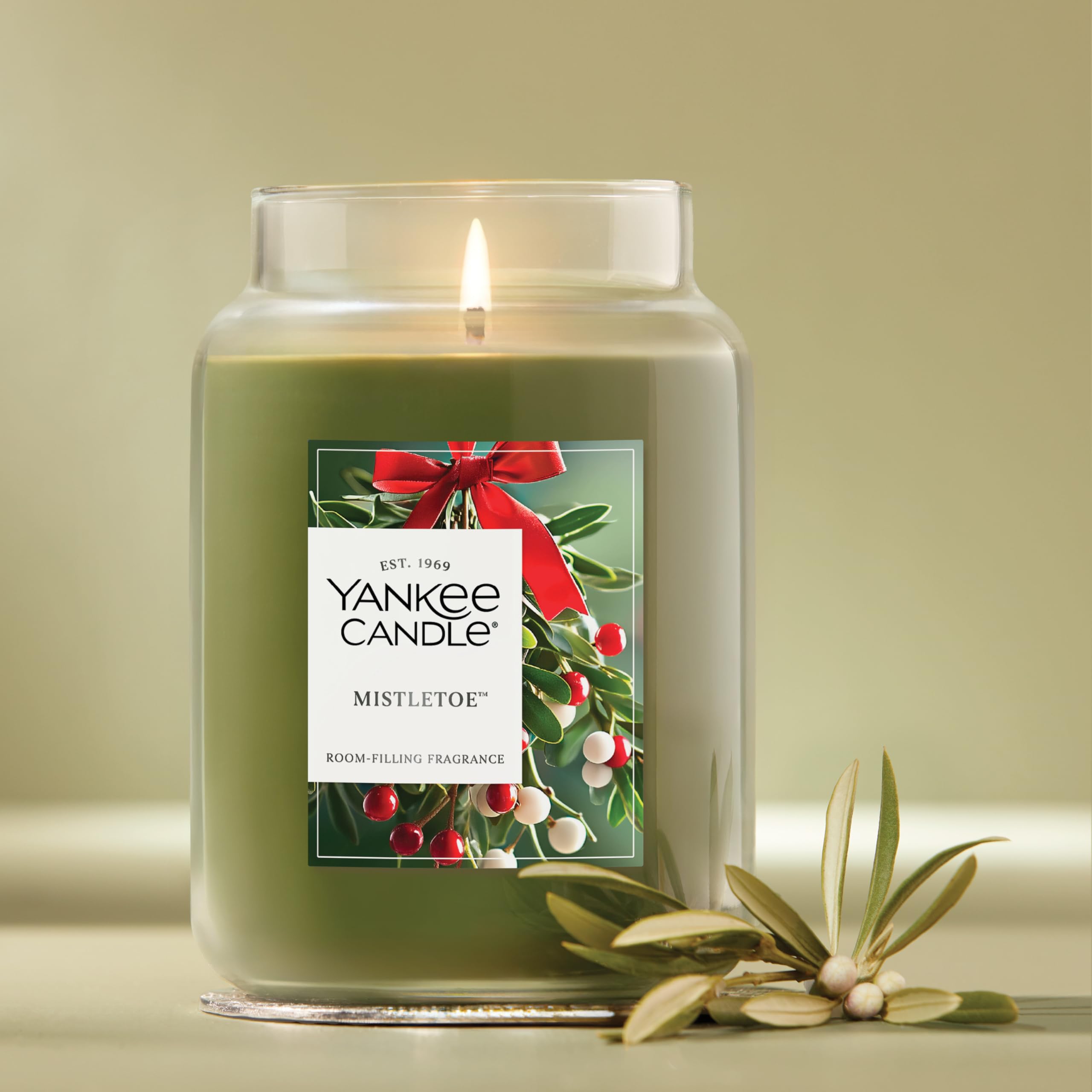 Yankee Candle lit jar with steady flame providing cozy holiday ambiance
