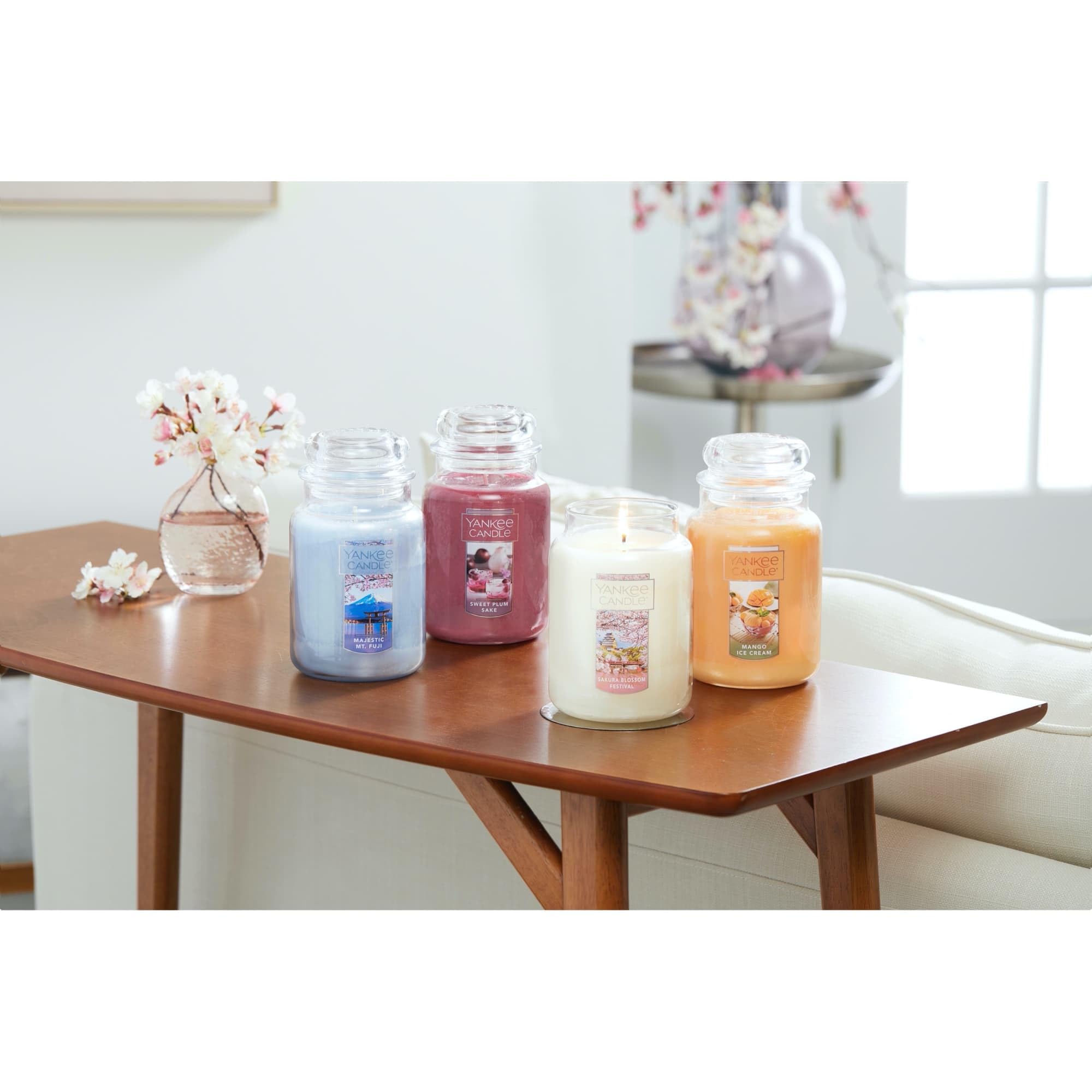Yankee Candle 22 oz candle next to common objects showing scale and long burn