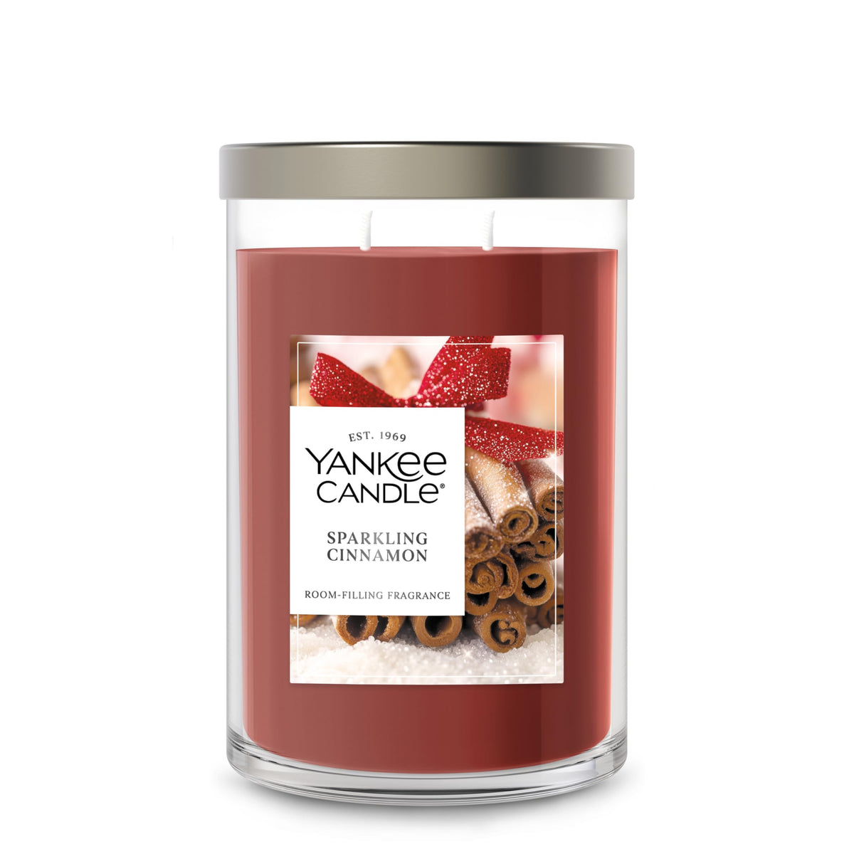 Yankee Candle front packaging showing Sparkling Cinnamon and elegant tumbler — warm welcome scent