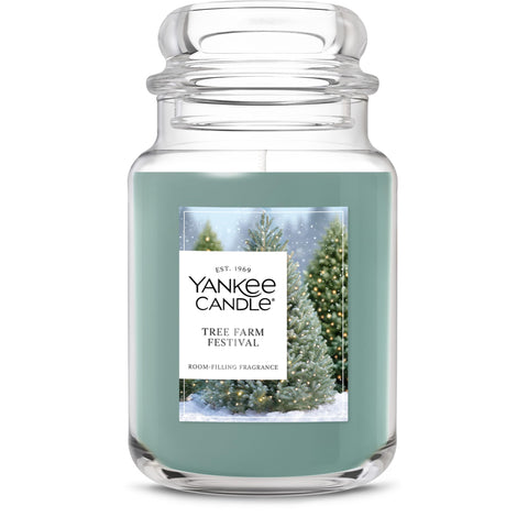 Yankee Candle front jar view showing festive pine scent and long burn benefit