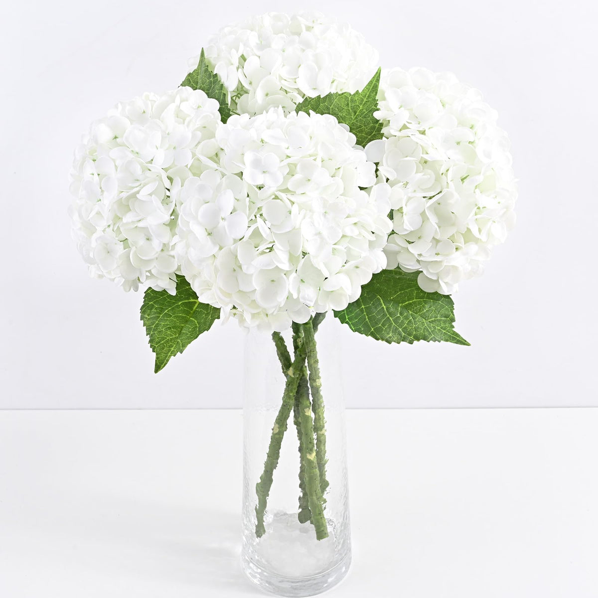 Yastouay front view showing four white hydrangea stems and packaging - elegant display