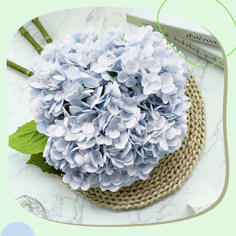Yatim arranged in a tall vase showing full seasonal centerpiece effect