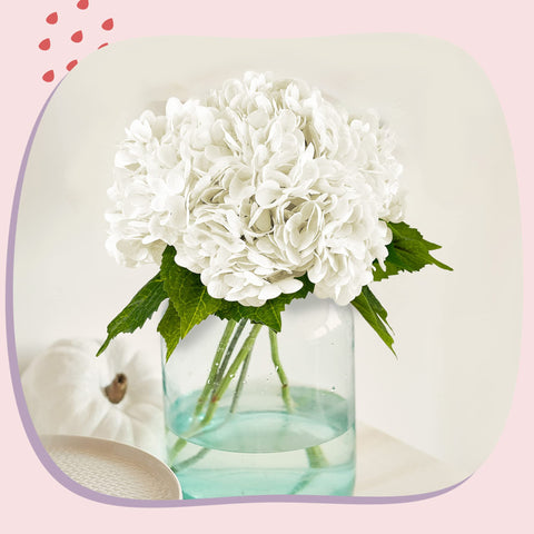 Yatim mixed bouquet idea with hydrangea, roses, and greenery for wedding decor
