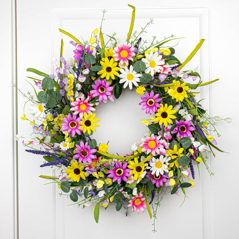 Yawwind wreath displayed on a window sill brightening indoor space