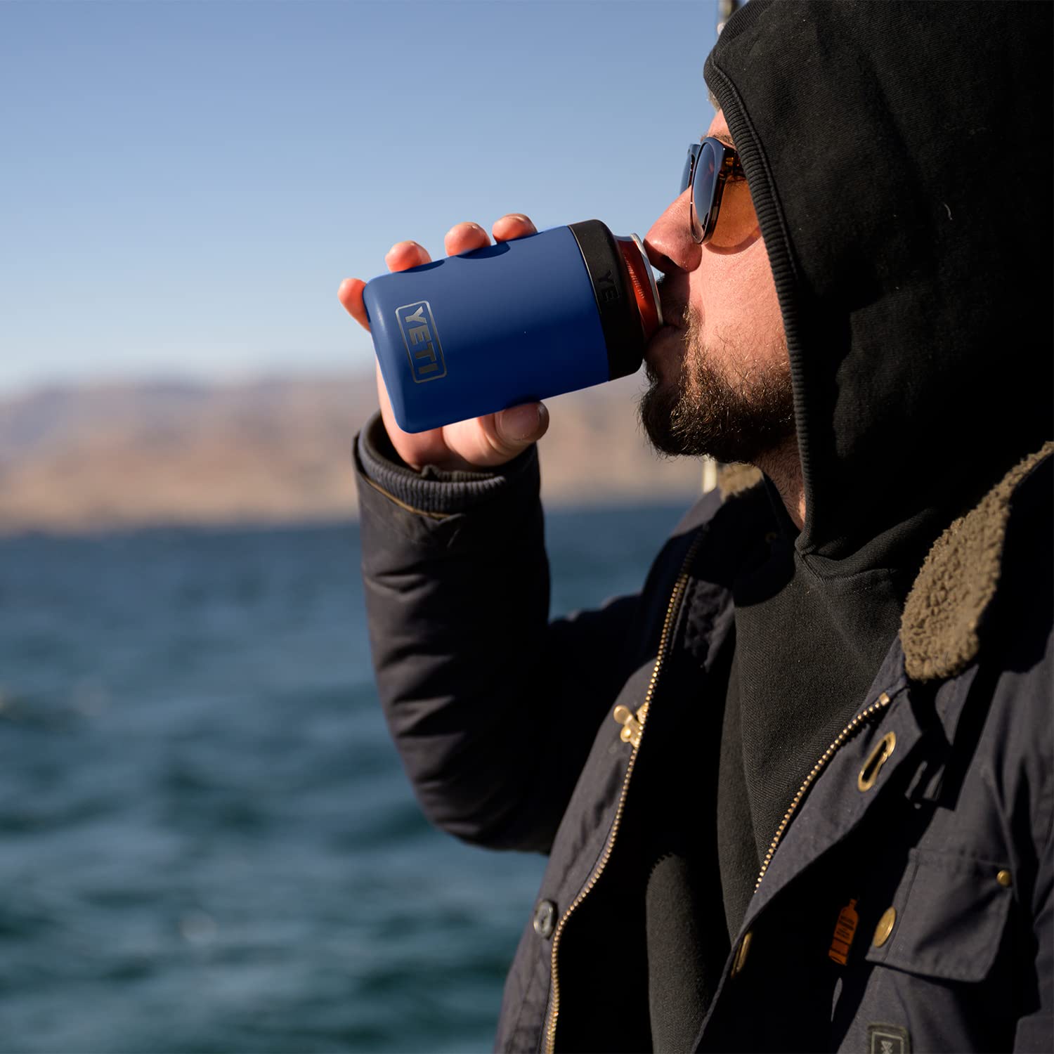 YETI Colster held in hand to show scale and portable convenience