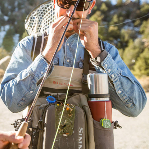 YETI cup cap at campsite illustrating rugged use and quick access advantage