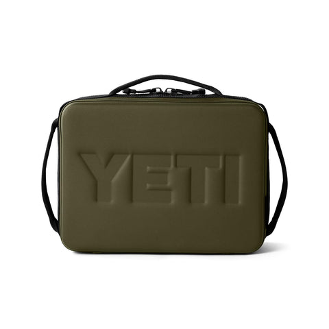 YETI Daytrip 5L next to water bottle showing scale and compact capacity benefit