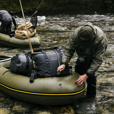 YETI Hopper M15 kangaroo pocket holding a phone to keep essentials handy and secure