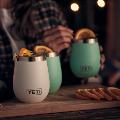 YETI Rambler with poured wine at picnic illustrating outdoor temperature retention