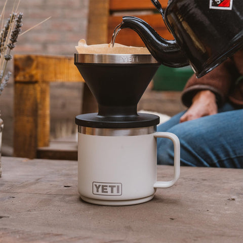 YETI Rambler beside standard mug showing scale and portability benefit